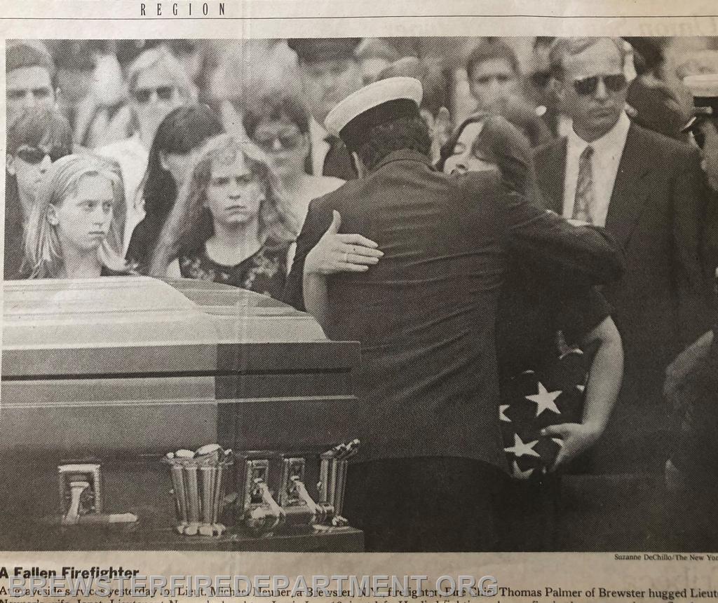 Photo #5
Chief Tom Palmer hugs widow at cemetery
