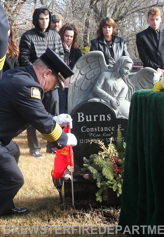 Photo #8
President Thomas Leather placing fireman's flag on Bunky's gravesite