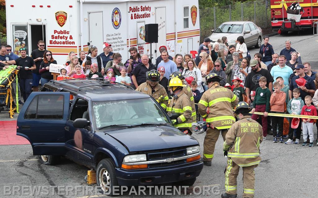 Photo #18
Bill Matturo, Greg Werner, Matt Chiara (Holding the the Jaws of Life) , Shane O'Connell extricating trapped driver after car was stabilized with cribbing
