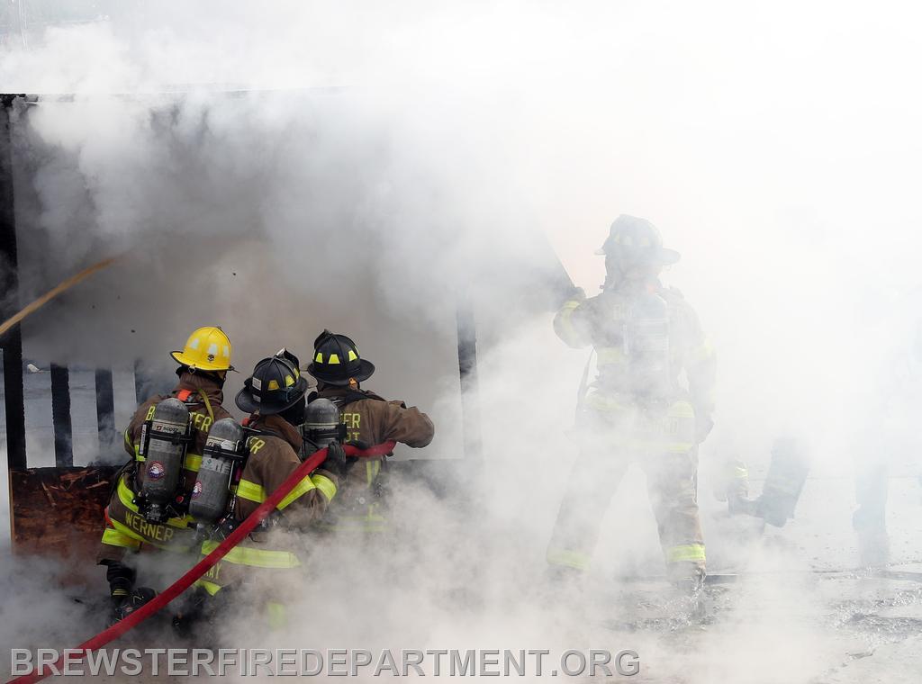 Photo #15
The fire is Almost out. Lt. Werner in yellow helmet, firefighter May Billy next to him