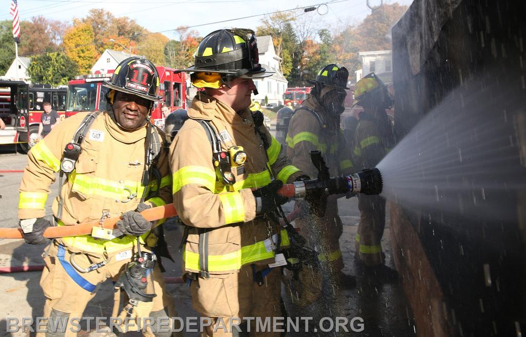 Photo # 28
Firefighter Sam Kentish and Rob Fox extinguishing fire.