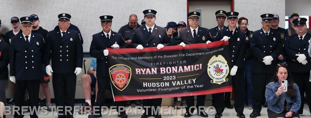 Photo #3
BFD members holding banner honoring Firefighter of the Year during ceremony