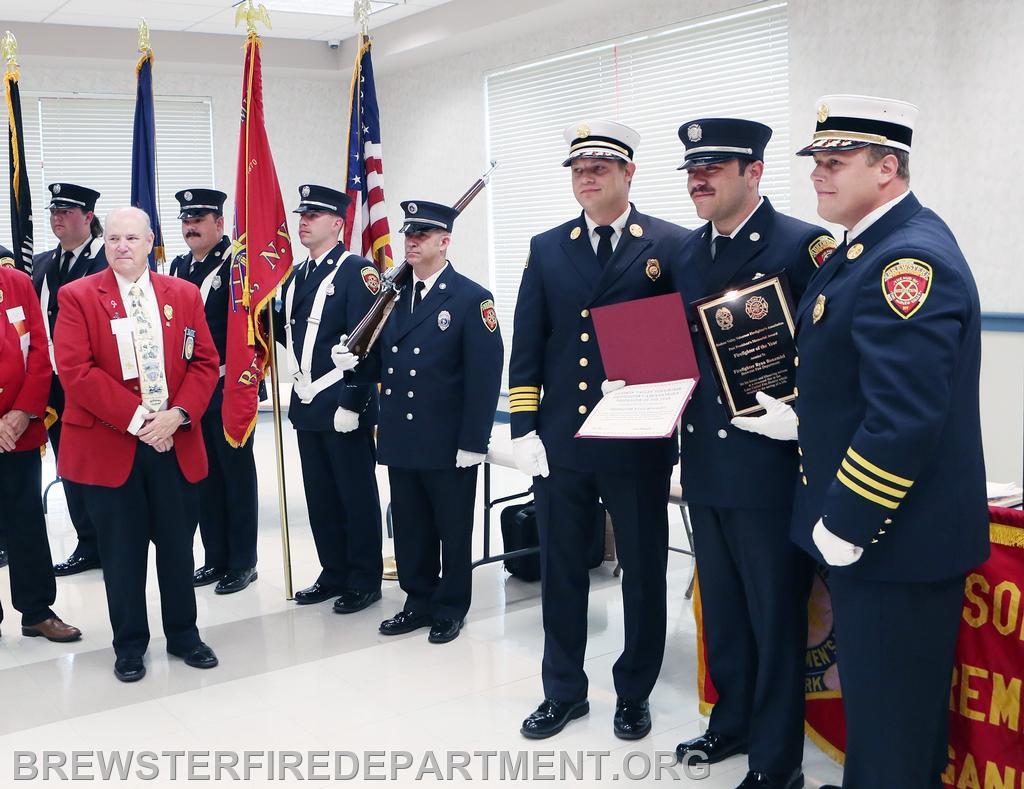 Photo #1
Chiefs Michael Miller and Steven Miller congratulate Firefighter Ryan Bonamici at Award Ceremony