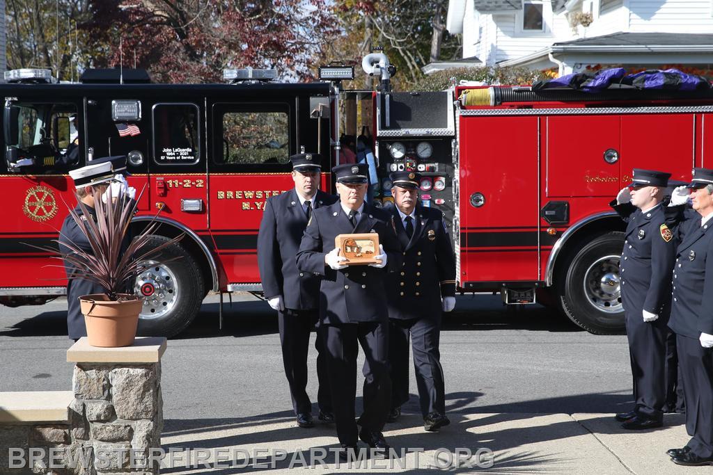 Honor Guard escorting John's urn into St. Lawrence Church for Mass of Christian Burial.